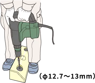 振動ドリルで路面に穴を開けているイラスト